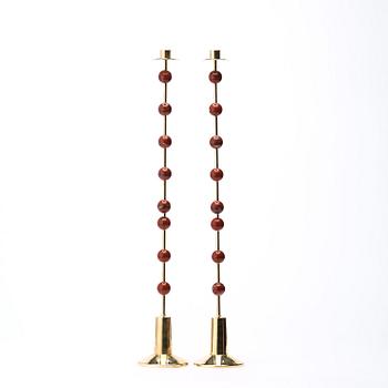 Sigurd Persson, A pair of brass and red jasper candlesticks, Uno Berg AB, Sweden.