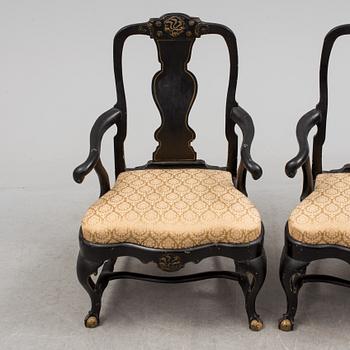 A pair of 18th century armchairs.