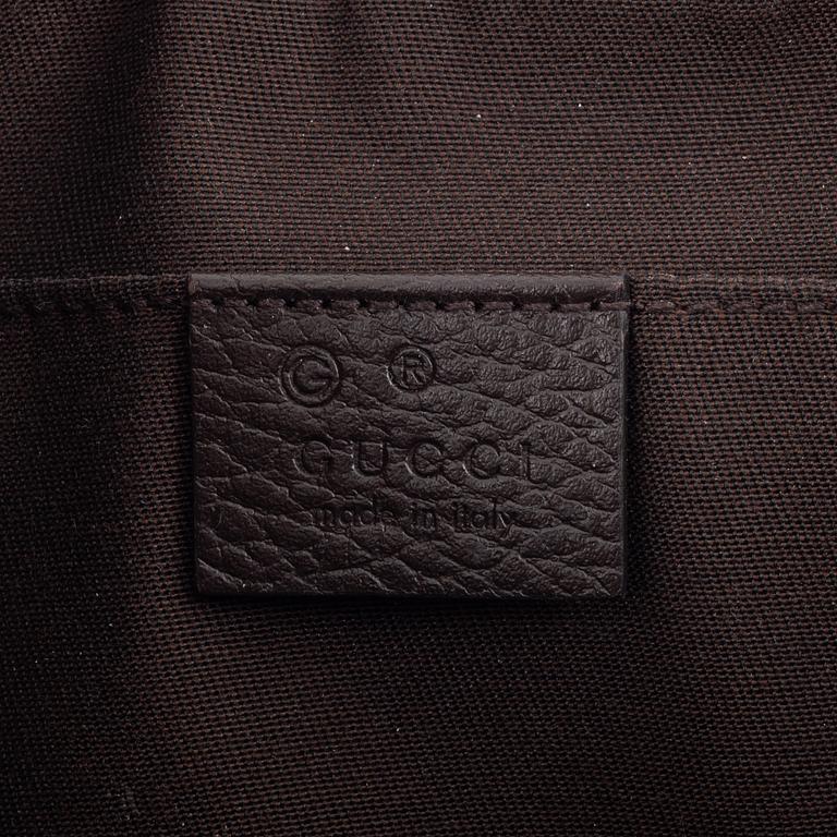 Gucci, a belt bag.