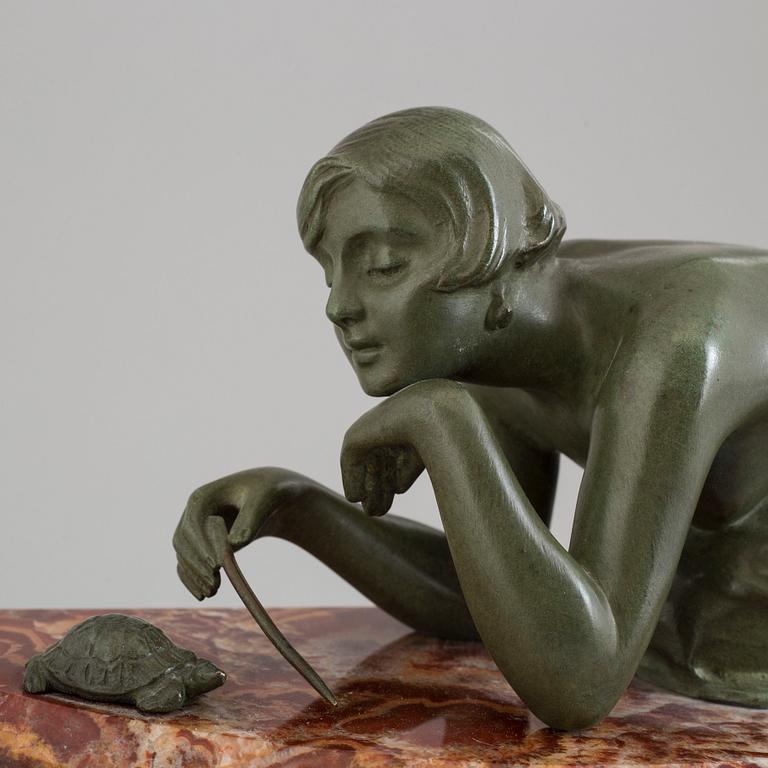 An early 20th century mantle clock with a bronze sculpture signed M. Charny.