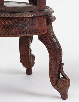 A pair of carved 'blackwood' armchairs, Bombay presidency, British Raj, circa 1880.