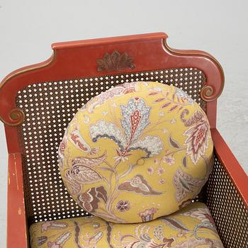 A Swedish Grace sofa, armchair and coffee table, Herbert Anderssons Möbelverkstäder, 1920's.