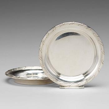 183. A matched pair of Swedish 19th century silver coasters, marked Mollenborg, Stockholm 1894 and 1900.