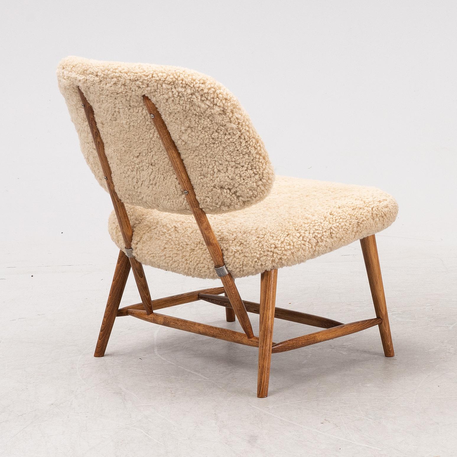 A TeVe easy chair by Alf Svensson, with new sheepskin upholstery, Studio Ljungs Industrier, 1950's.