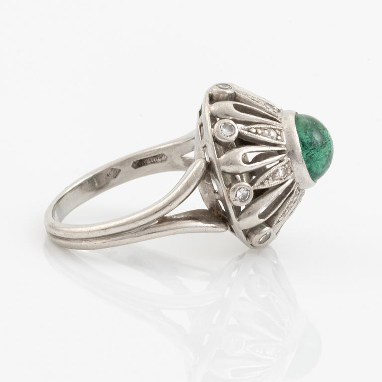 An A Tillander ring set with a cabochon-cut emerald.