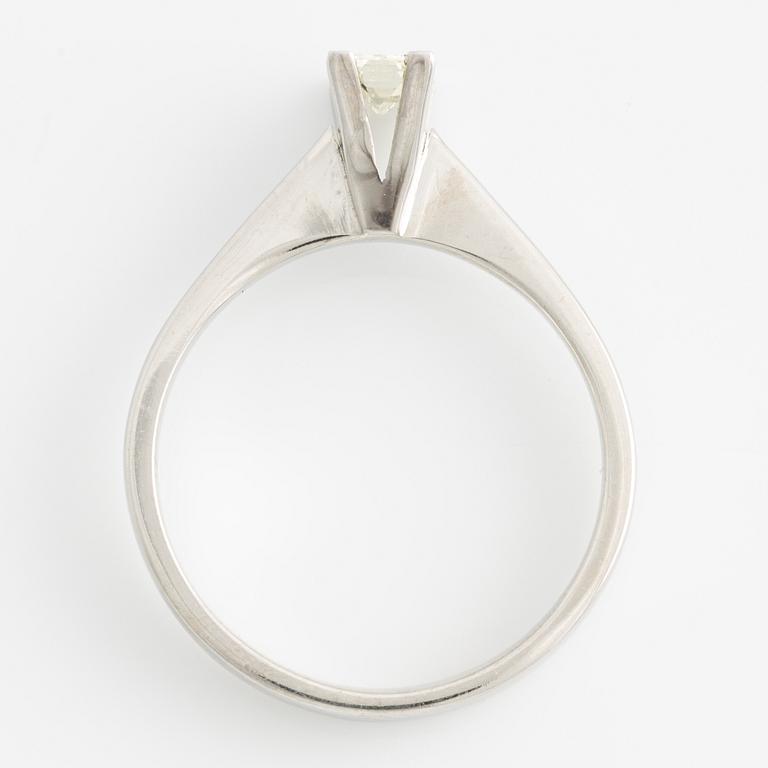 Ring with baguette-cut diamond.