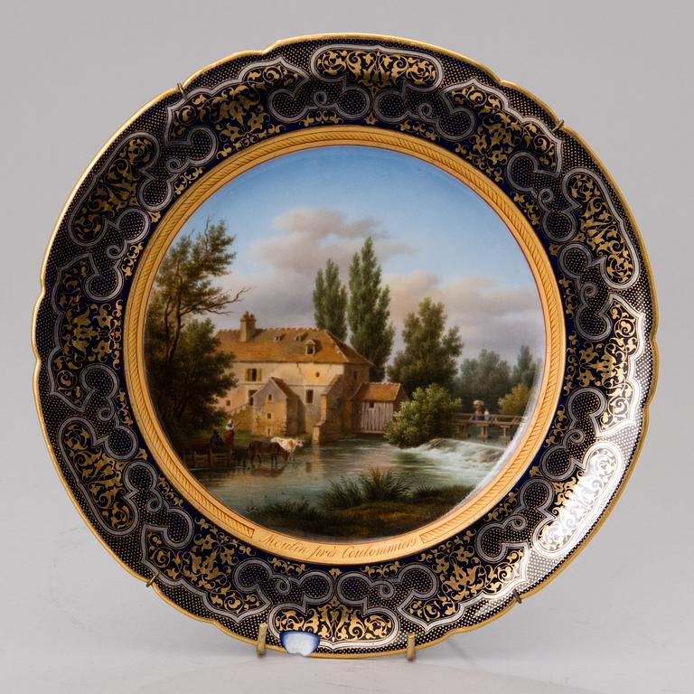 A set of 3 French porcelain decorative plates from the latter half of the 19th century.