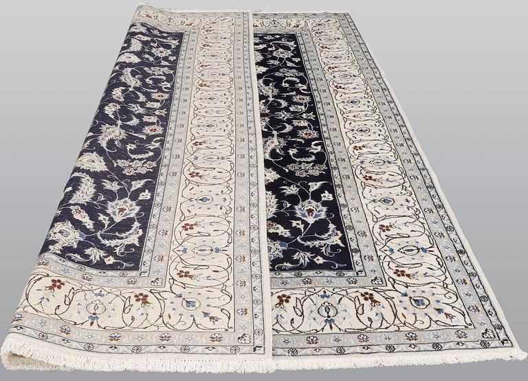 A carpet, Nain, part silk, ca 350 x 247 cm.