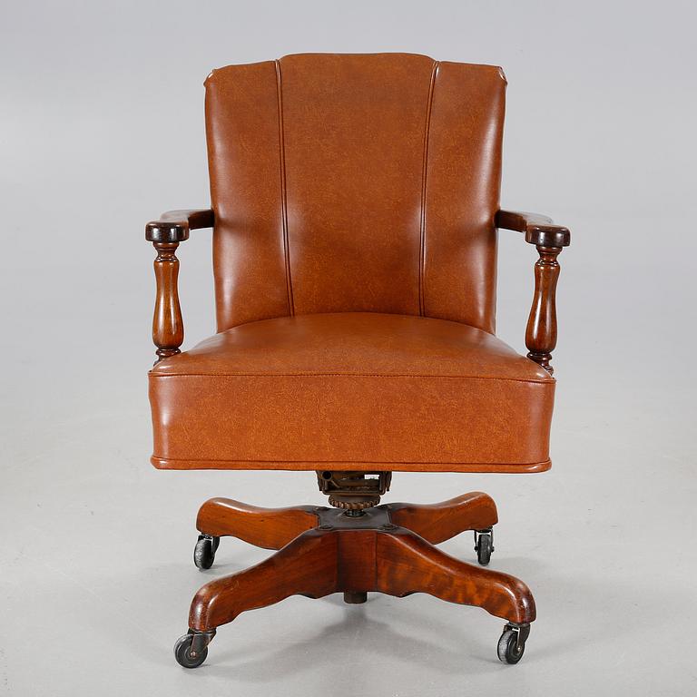 A desk chair from The Marble & Shattuck Chair Company in Ohio, around the mid 20th century.