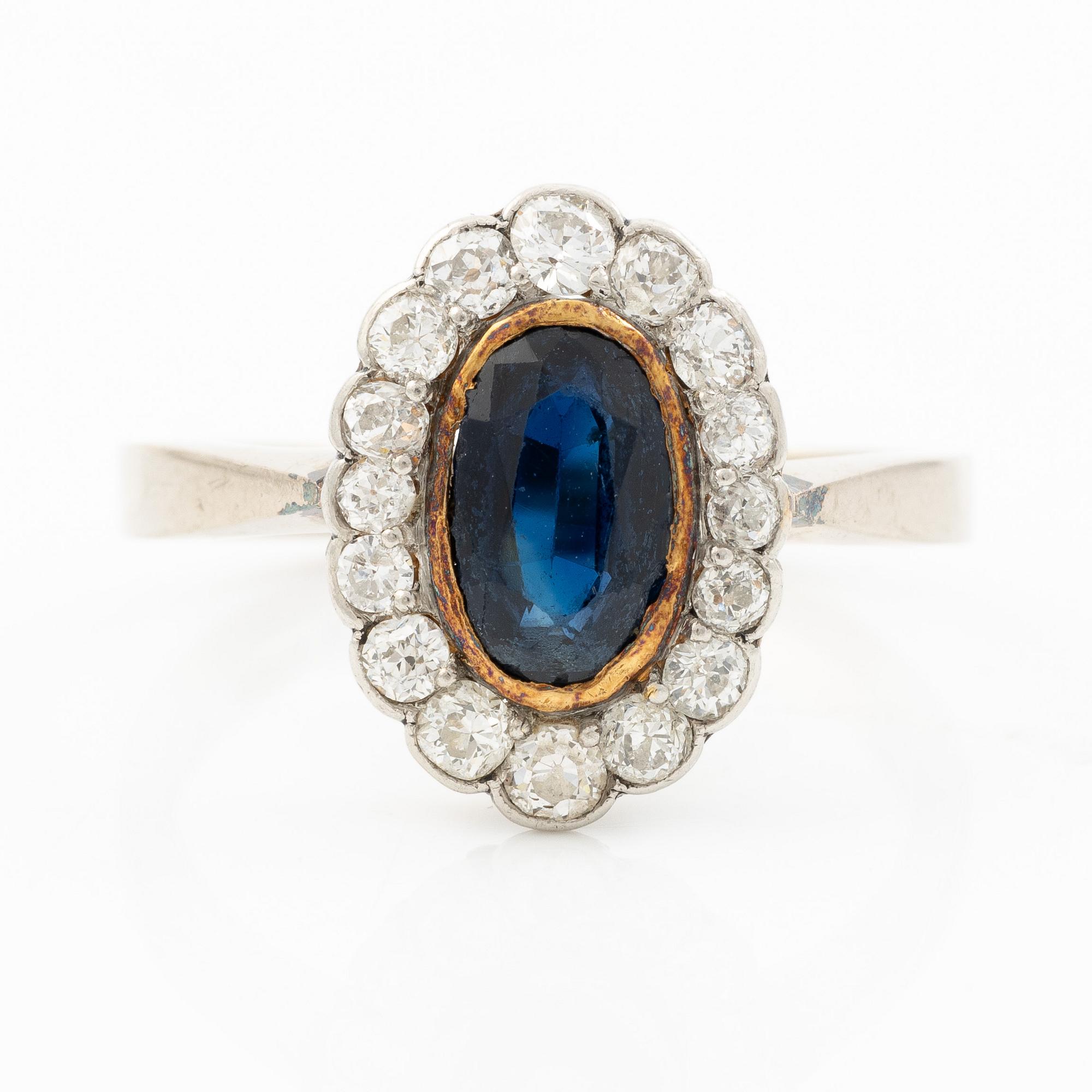 Ring, camrose model, 18K white gold with sapphire and old-cut diamonds.