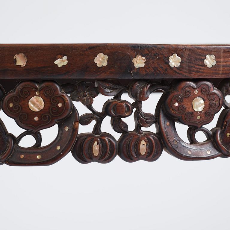 A Chinese hardwood demi-lune side table with mother-of-pearl inlays, late Qing dynasty.