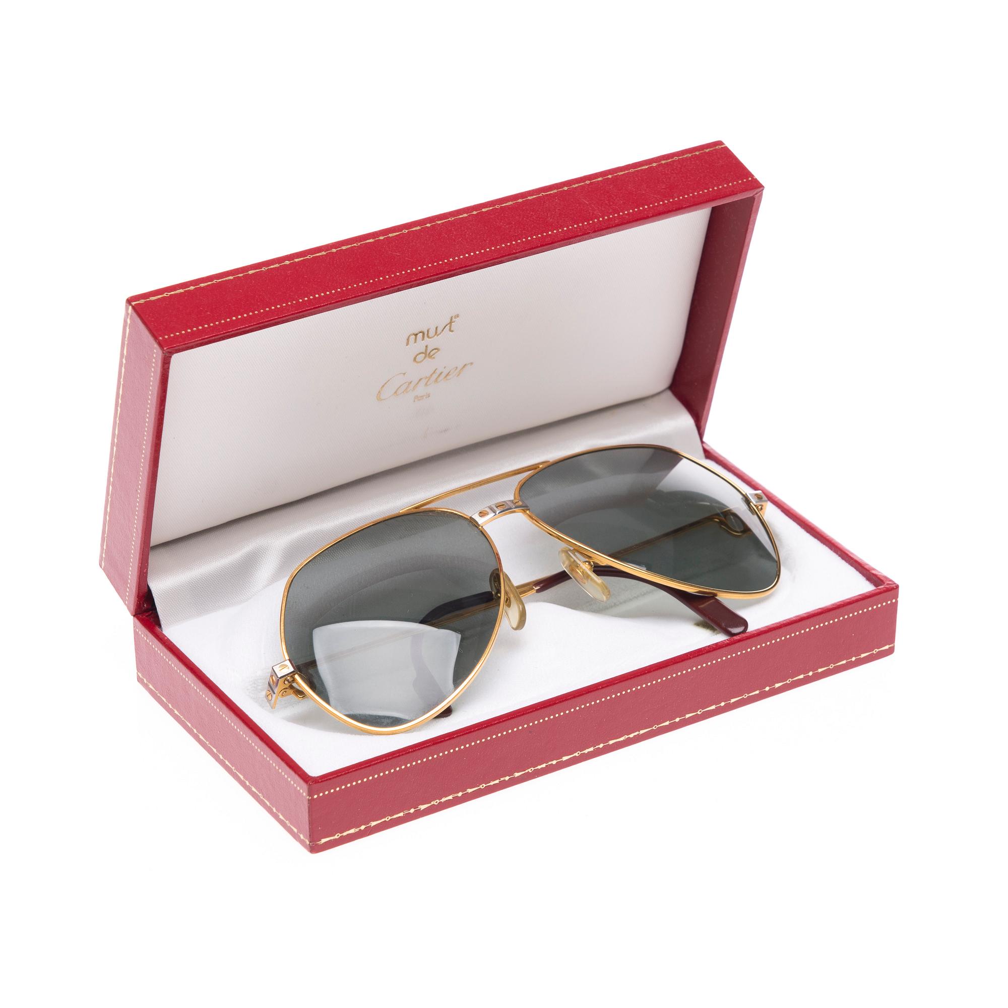 SOLGLASÖGON, Cartier.