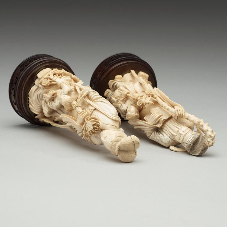 A pair of Chinese ivory figures, early 20th Century.