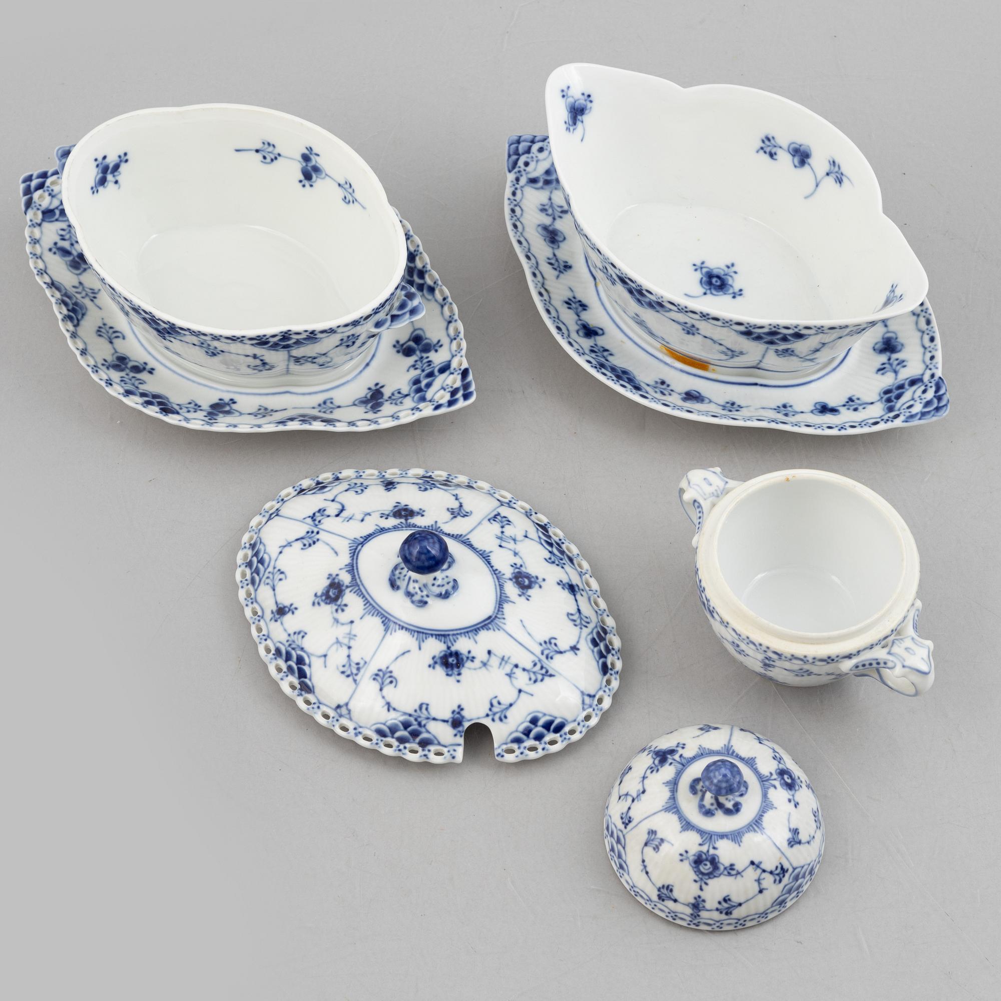 Royal Copenhagen, a 116-piece 'blue Fluted' porcelain dinner and coffee service, half lace, Denmark, mostly 1923-34.