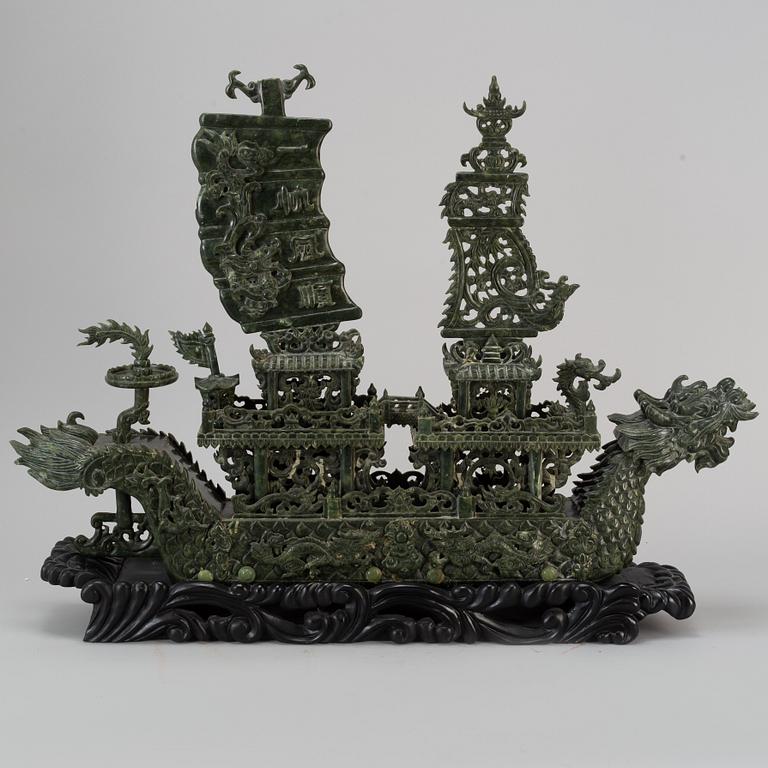 A large Chinese green stone carved sculpture, 20th century.