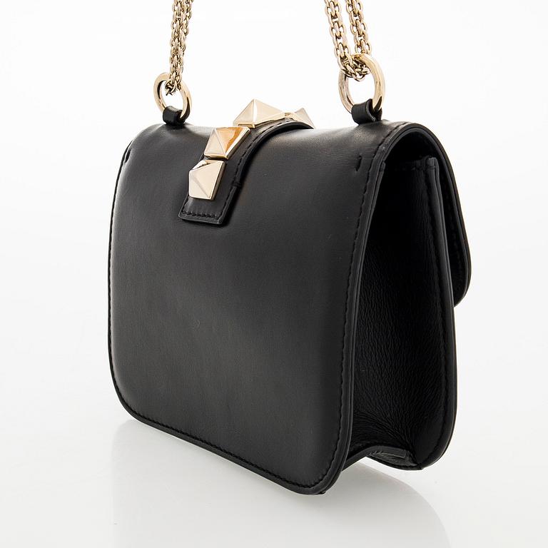 Valentino Garavani, a 'Glam Lock' bag.