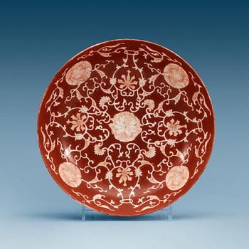 A set of three coral red dishes, Qing dynasty, with Daoguang seal mark.