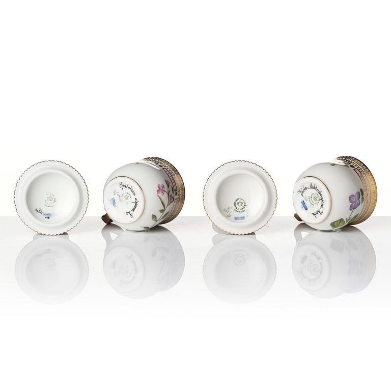 A set with four Royal Copenhagen 'Flora Danica' custard cups with covers and stands, Denmark, 20th century.