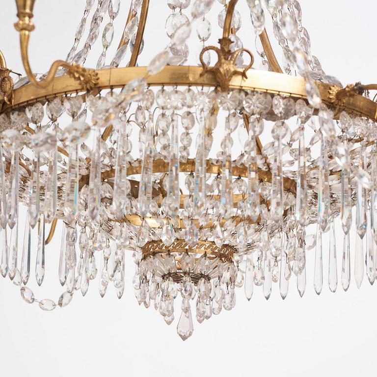 A German Louis XVI gilt-brass and cut-glass six-light chandelier, late 18th century.