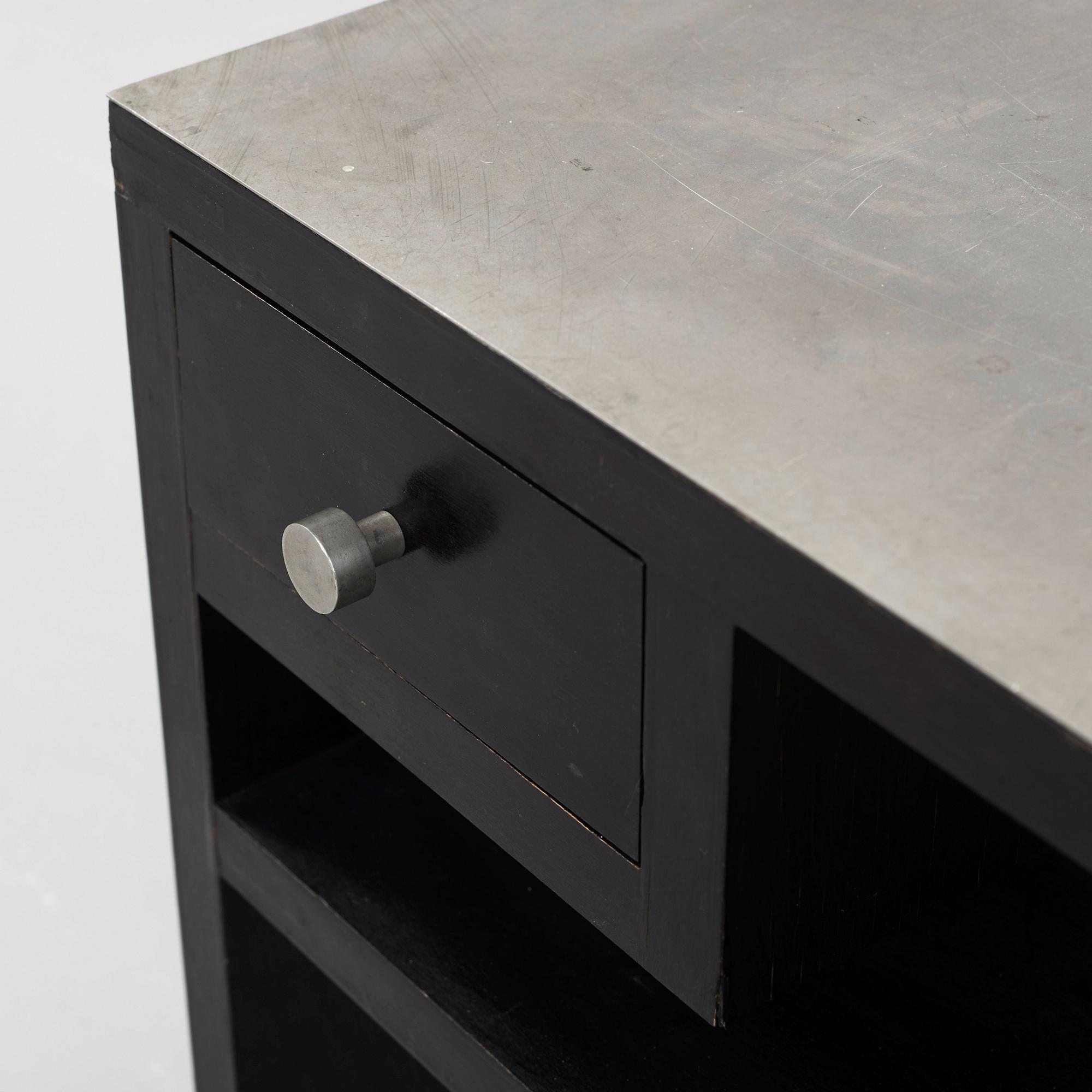 An Uno Åhrén black lacquered birch and pewter side table, Svenskt Tenn, Stockholm ca 1930.