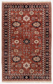 A semi-antique Orientall carpet c. 318 x 202 cm.