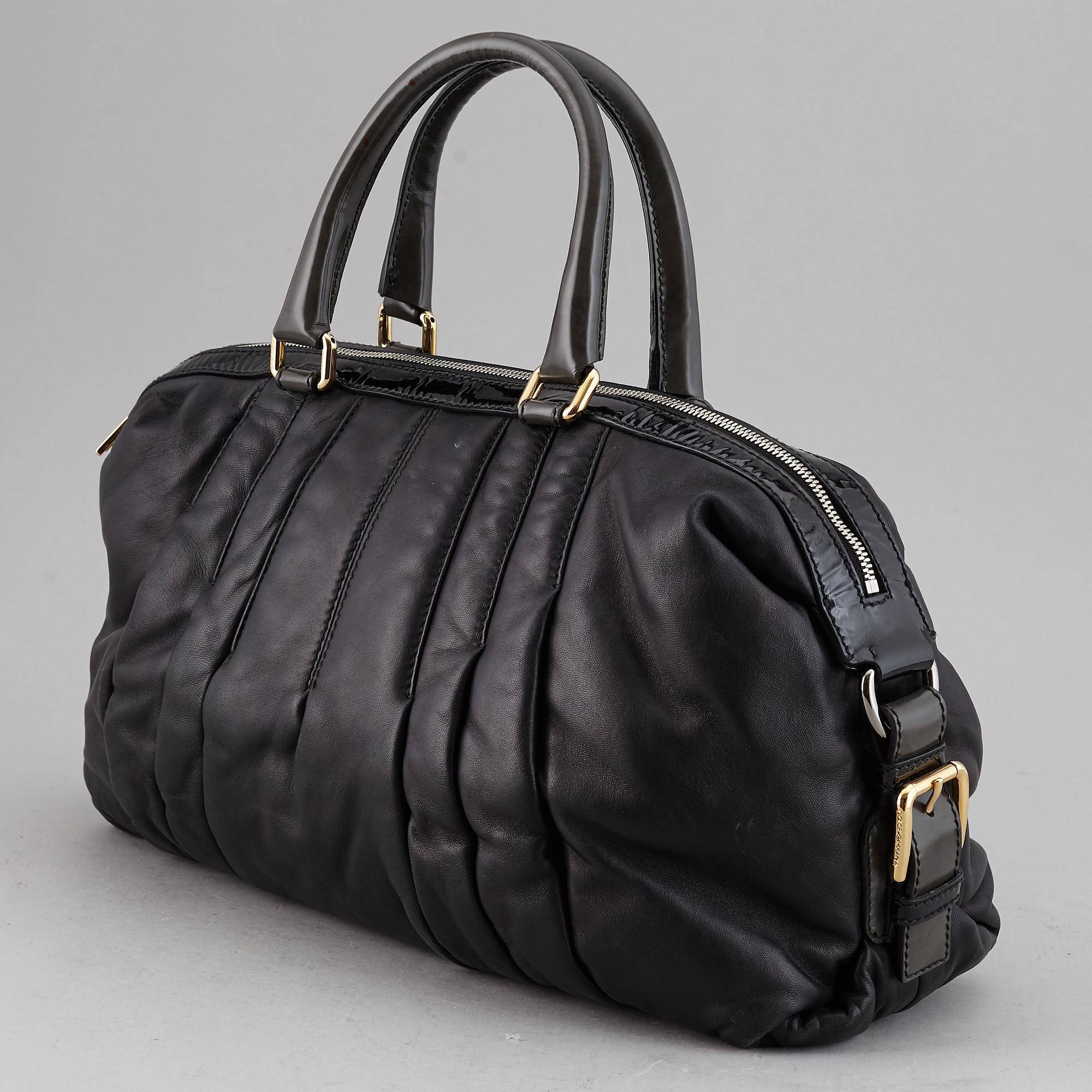 DOLCE & GABBANA, a black leather bag.