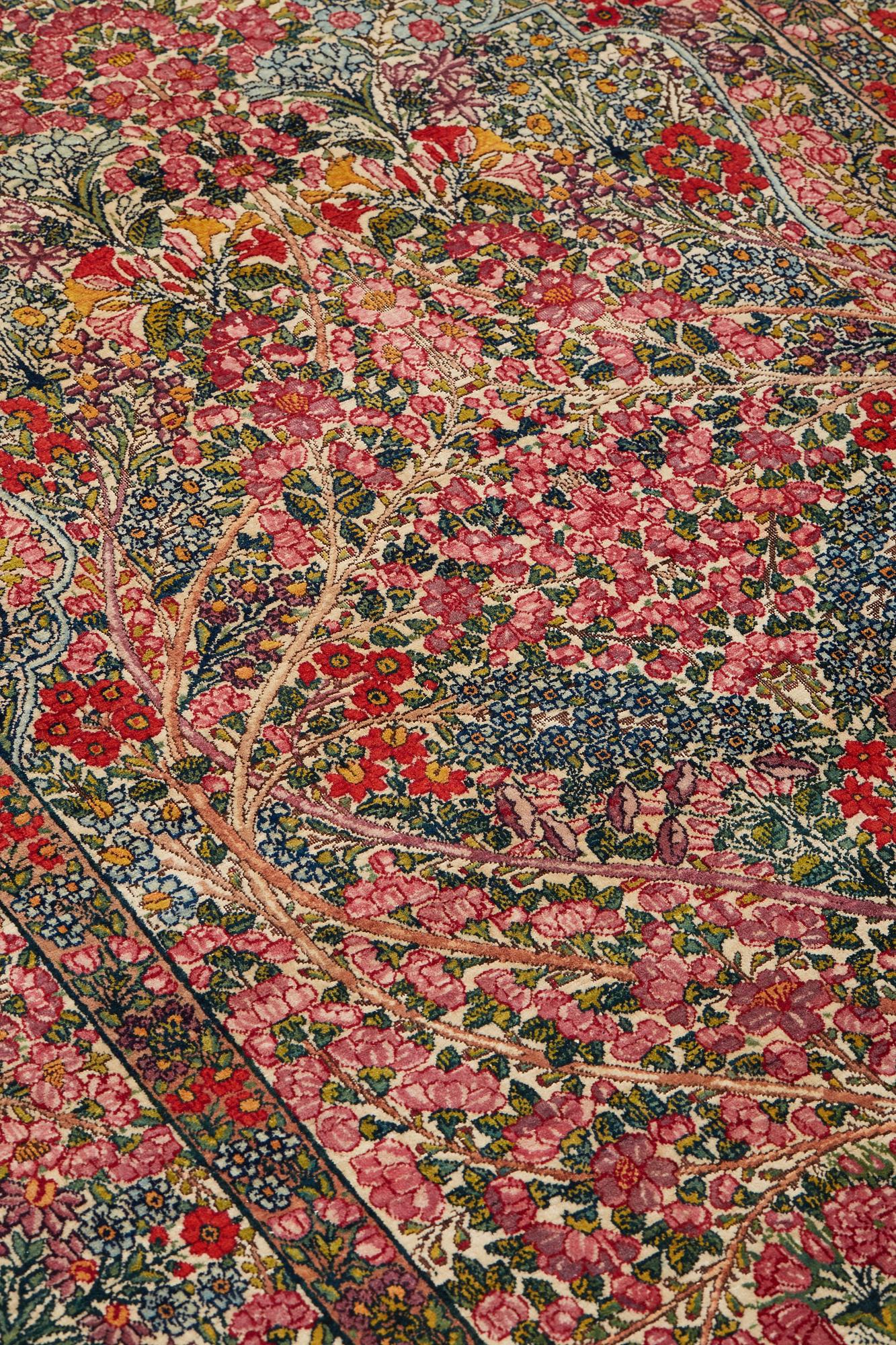 A RUG, a semi-antique Kerman "mille-fleur", ca 198,5 x 136,5 cm.