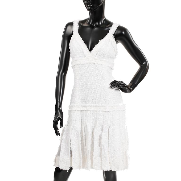 CHANEL, a white bouclé dress, 2004.