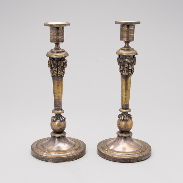 A pair of early 19th century Empire silver plated bronze candleholders.