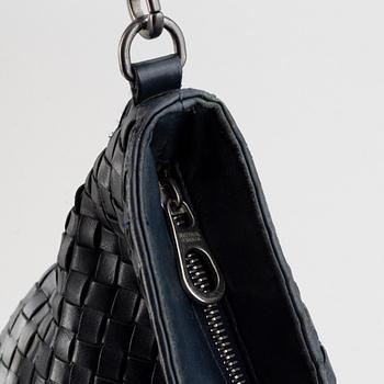 Bottega Veneta, a navy Intrecciato leather messenger bag.