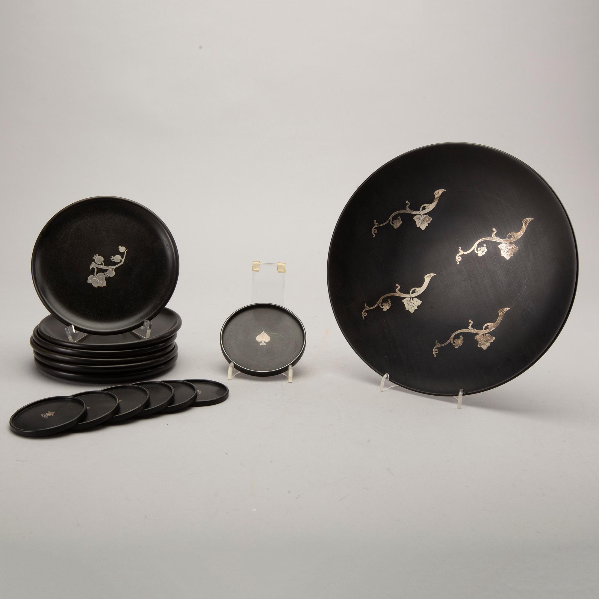 A Swedish 20th century set of 14 plates in bakelite and silver mark of T Wendt Helsingborg 1945.