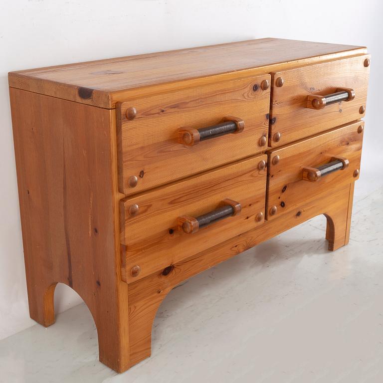 A 1970's set with a pine mirror and chest of drawers.