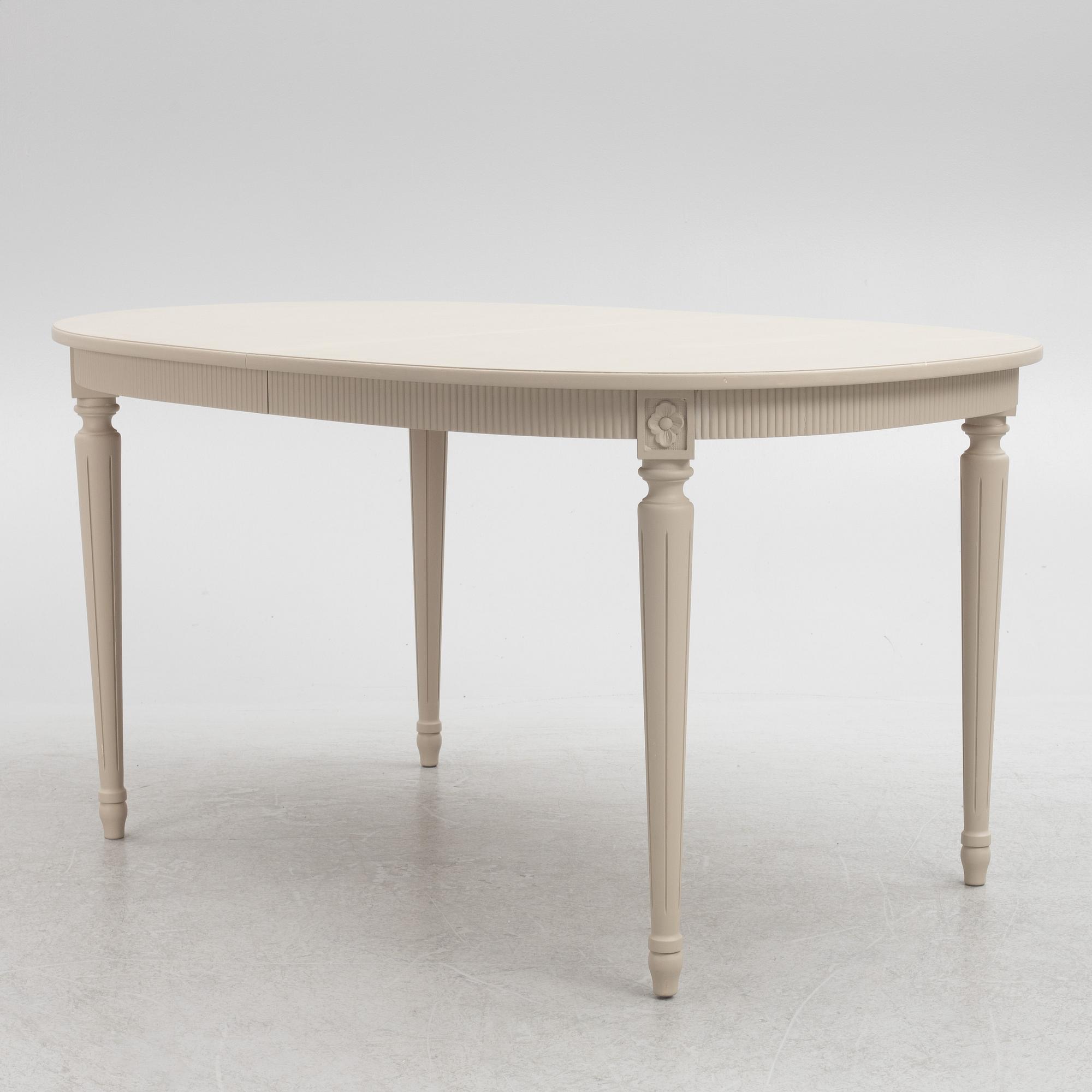 A Gustavian Style Dining Table and 10 Chairs, second half of the 20th Century.