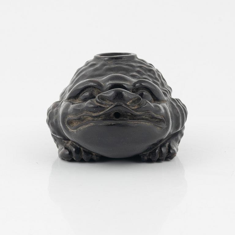 A wooden brushpot in the shape of a three legged toad, China, 20th Century.