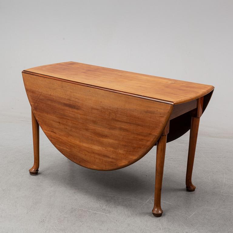 An end of the 19th Century mahogany drop leaf table.