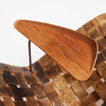 Arne Vodder, a woven leather lounge chair with attached side table, Bovirke, Denmark, 1950s.