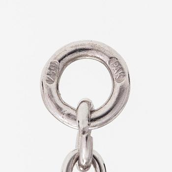 An 18K whitegold necklace with a diamond ca 1.01 ct, smaller diamonds tot. ca 0.15 ct, ruby and 
sapphires, Helsinki.