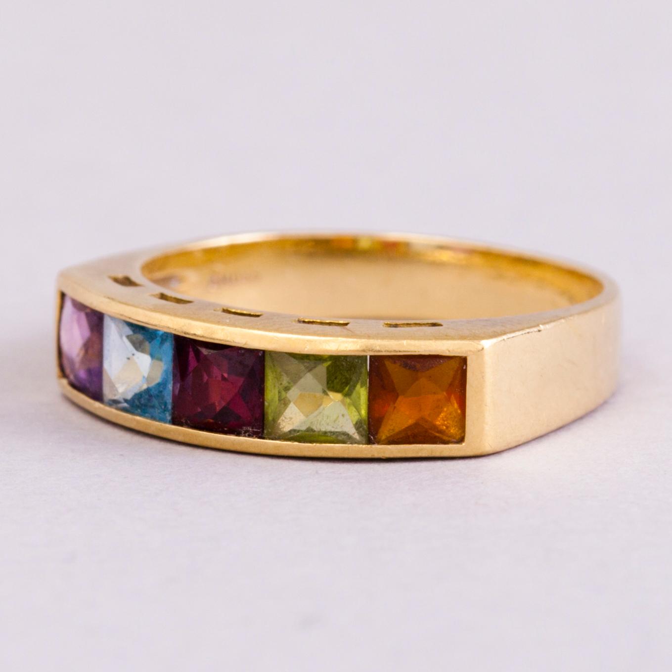 A 18K gold ring with 5 different stones: citrine, amethyst, topaz, garnet, peridot and a small diamond. Probably H.Stern.