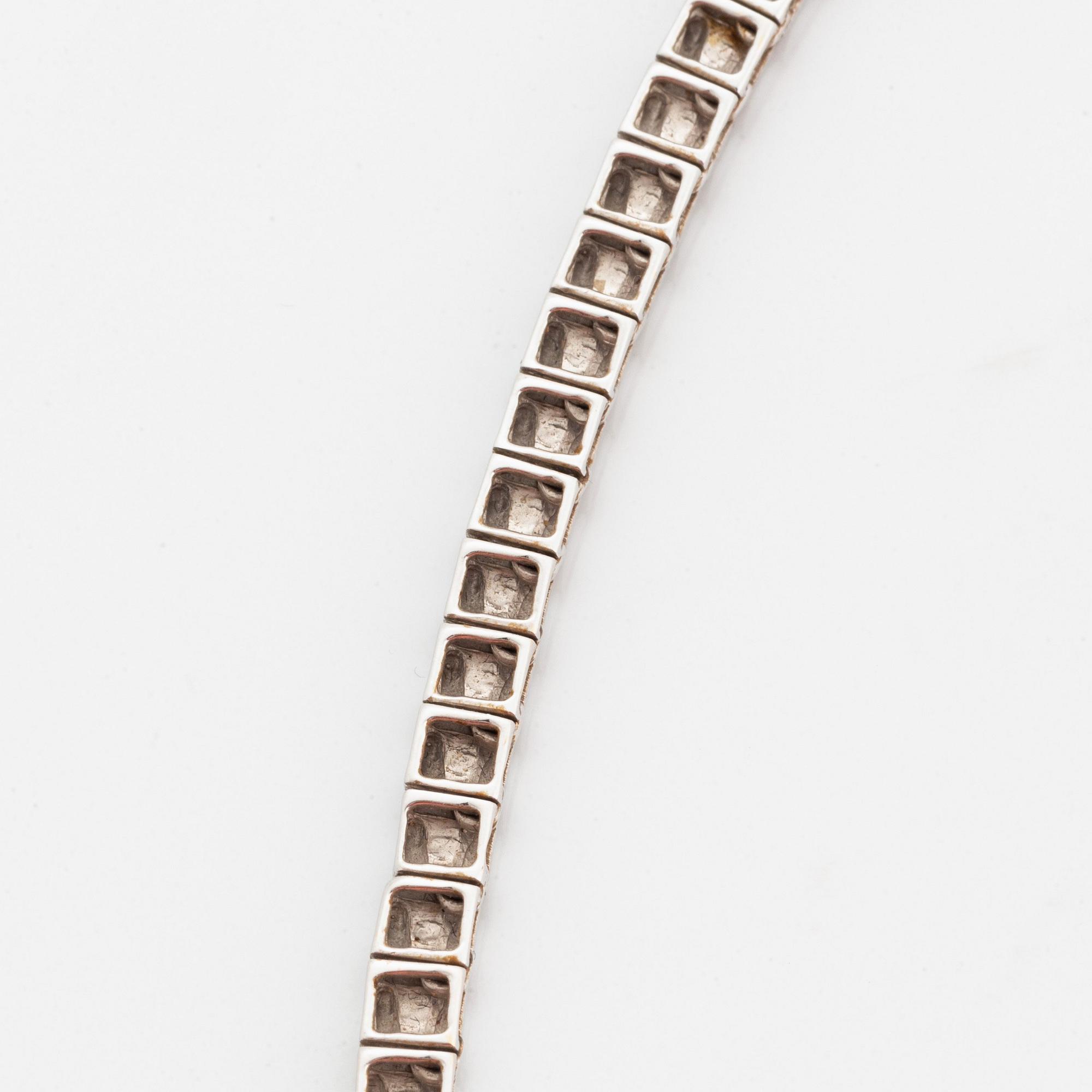 Collier rivière 18K vitguld runda briljantslipade diamanter.