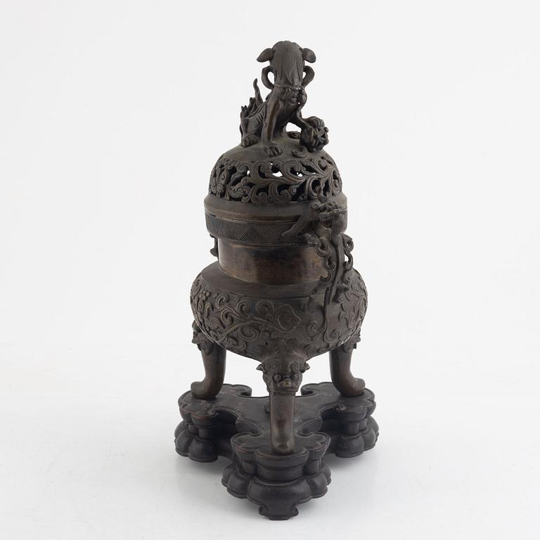 A tripod bronze censer with cover, Qing dynasty, 19th century.