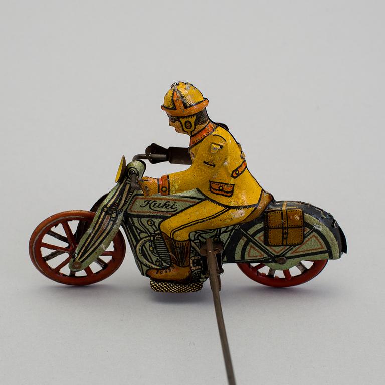 A tinplate Huki roundabout motorcycle, Germany, 1930s.