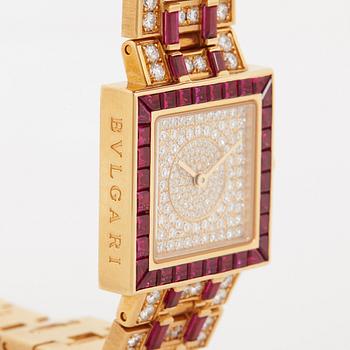 A Bulgari wristwatch in 18K gold set with step-cut rubies and round brilliant-cut diamonds.