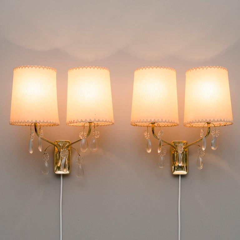 A pair of early 1950s '9413' wall lights for Taito, Finland.