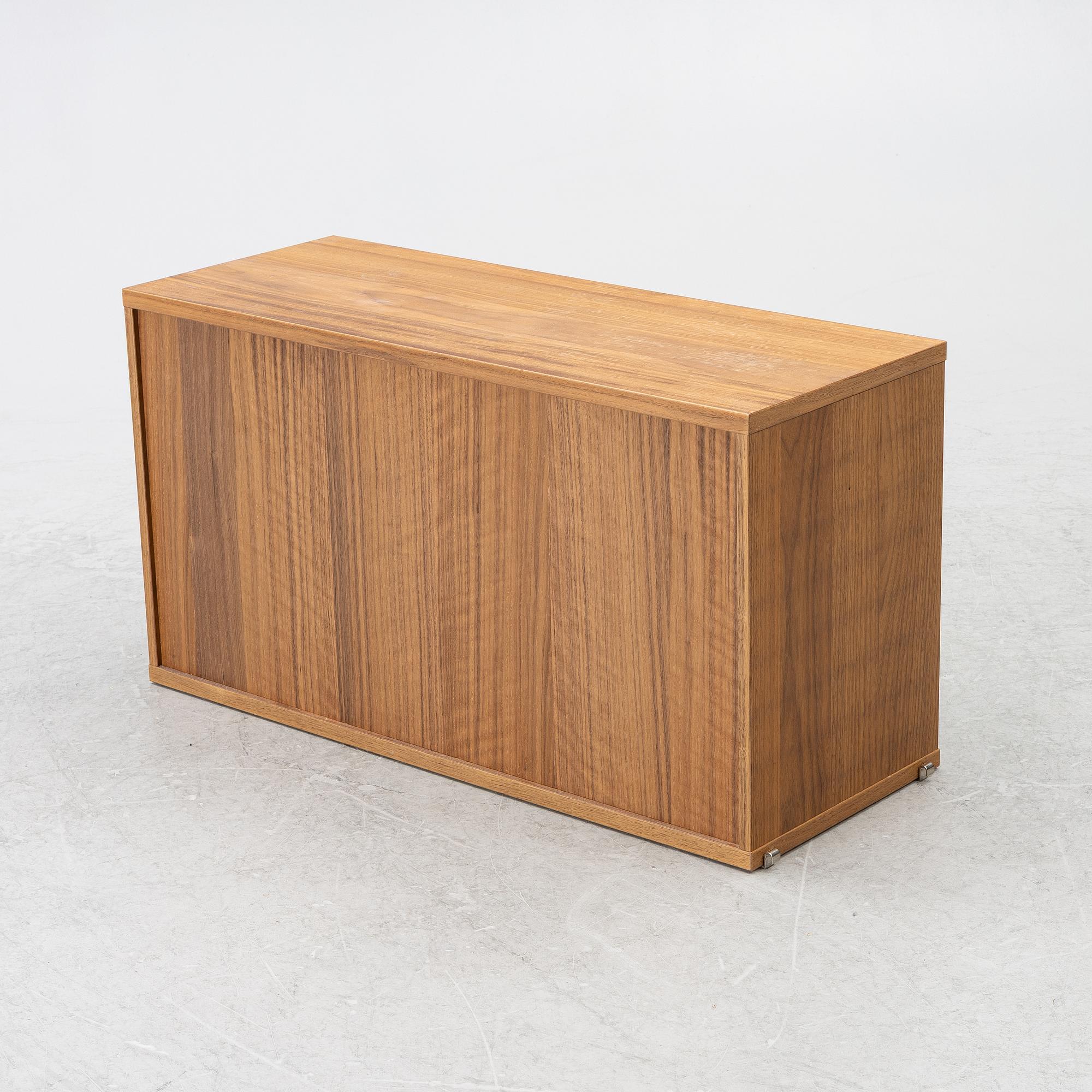 Nils Strinning, a "String" book case with cabinet, Sweden, 21st century.