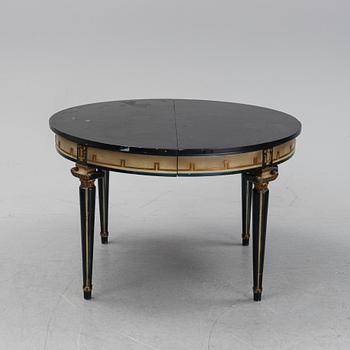 A painted, round art deco dining table from the 1920s.
