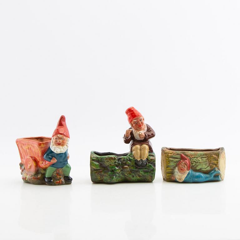 A collection of gnomes 12 pcs mid/late 20th century mostly painted terracotta.