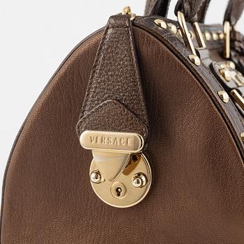 Versace, a bronze metallic leather handbag.