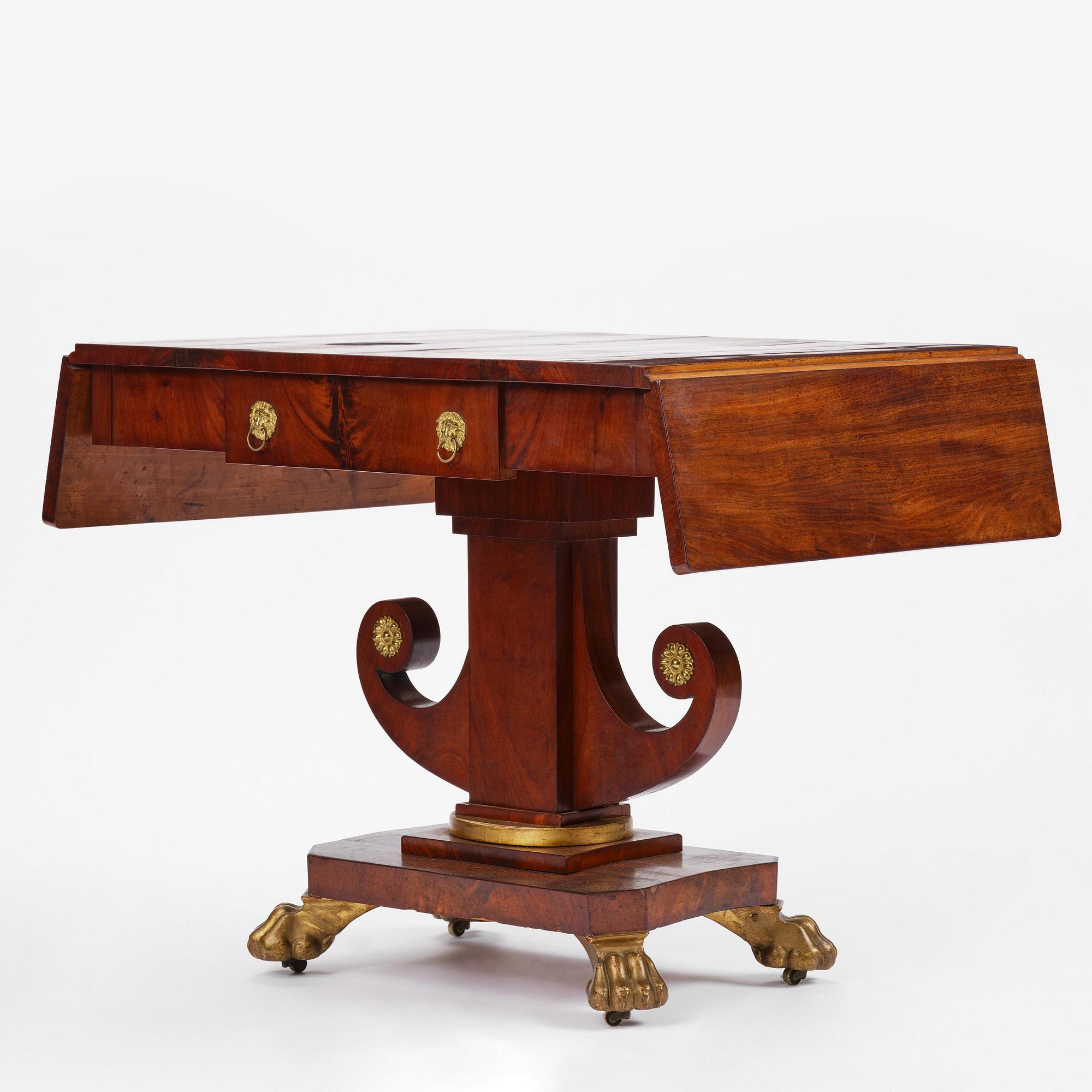 A Swedish Empire mahogany center table.