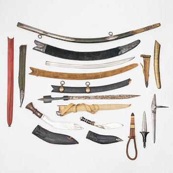 Daggers and sword scabbards, 12 pieces.