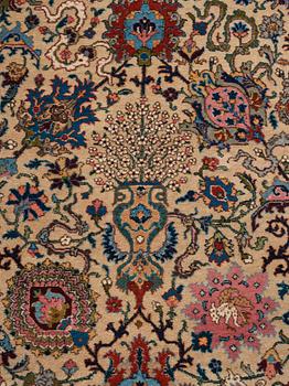 A RUG, a semi-antique Tabriz, ca 198 x 142 cm.